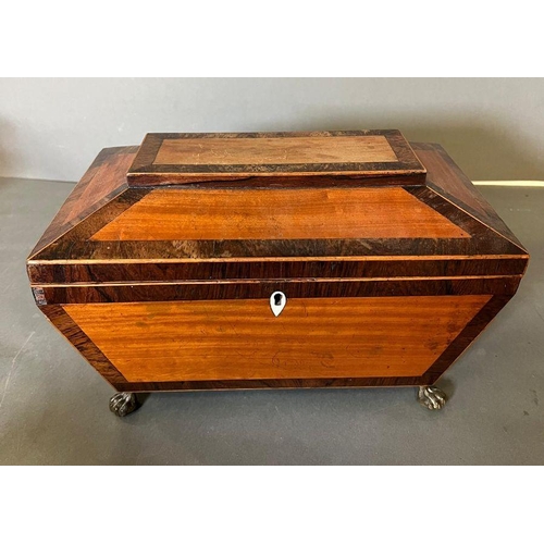 119 - A sarcophagus tea caddy with inlay and brass lion paw feet. Inside has been relined in felt and hand... 