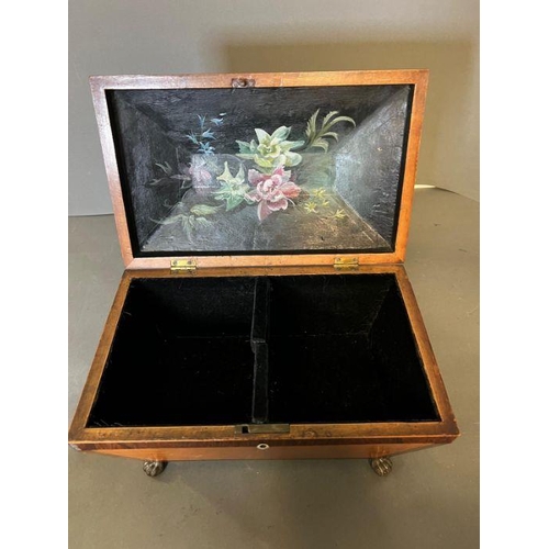 119 - A sarcophagus tea caddy with inlay and brass lion paw feet. Inside has been relined in felt and hand... 