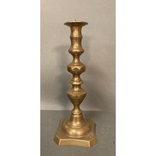 123 - A selection of brass items to include candle sticks and a plate