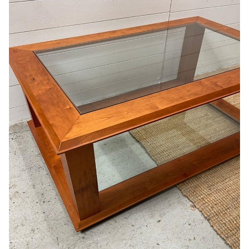 19 - A cherry wood coffee table with glass panel to top and base (H47cm W120cm D80cm)