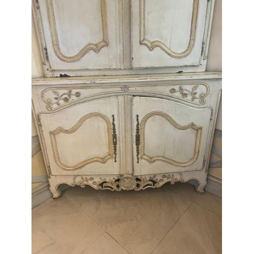 21 - A large French style corner unit with panelled doubled doors to top and bottom opening to reveal she... 