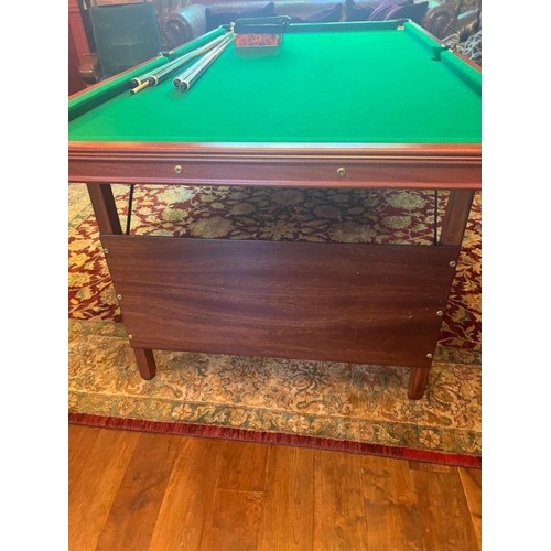 24 - A folding pool/snooker table with sundries