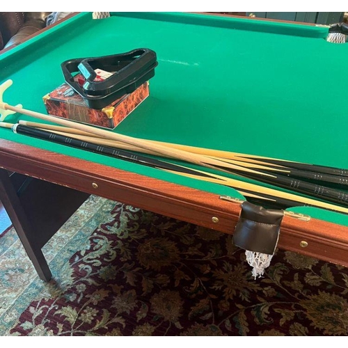 24 - A folding pool/snooker table with sundries