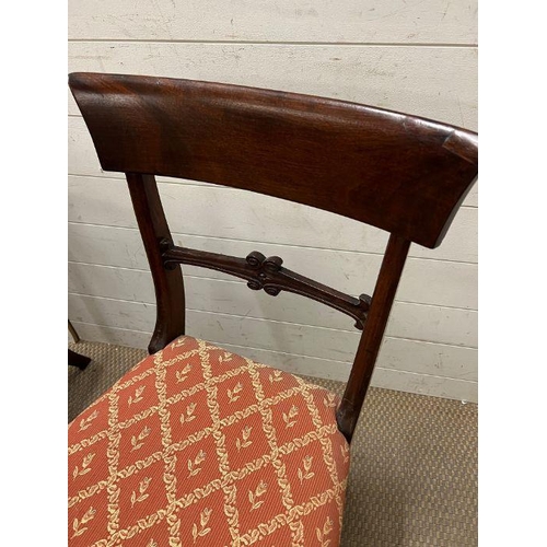 33 - A William IV style mahogany dining table, circular top over a octagonal column and raised on a tri-f... 