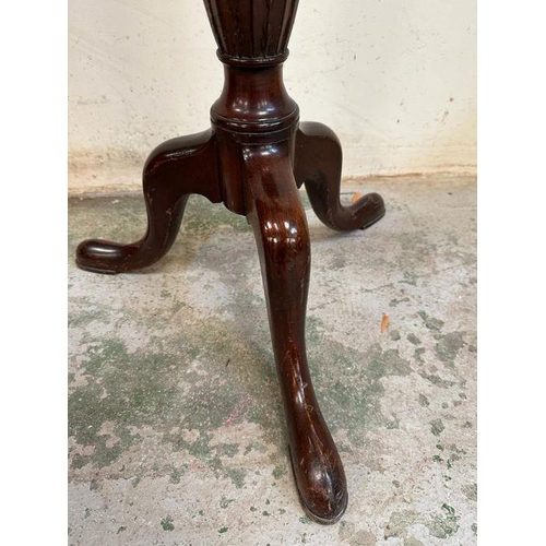 4 - A mahogany plant stand with carved central column on splayed legs (H109cm)