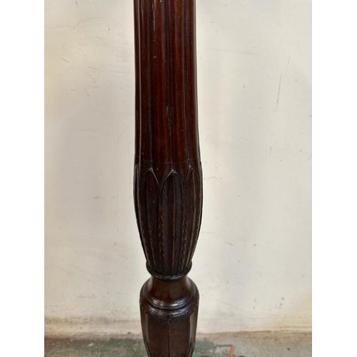 4 - A mahogany plant stand with carved central column on splayed legs (H109cm)