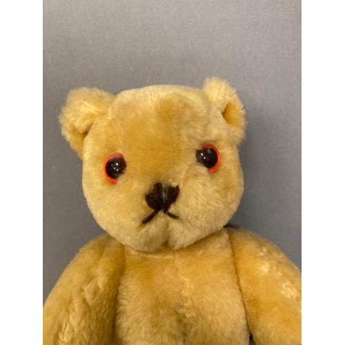 40 - A vintage teddy bear with jointed arms and legs.