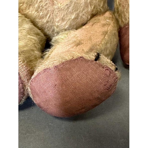 45 - An unusual and early straw filled teddy bear, probably English, perhaps Chiltern, with lovely face, ... 