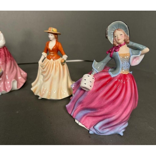 50 - A selection of eight Royal Doulton figures to include Winter Day, Melanie, Laura and Autumn Breeze