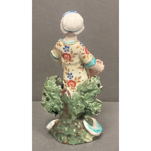 51 - A Derby figure of a flower girl holding a basket