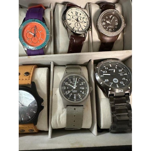 629 - A selection of wristwatches in display case to include: Bulova, Geneva, Skmei, Infantry, 18 in total... 