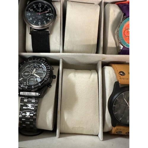 629 - A selection of wristwatches in display case to include: Bulova, Geneva, Skmei, Infantry, 18 in total... 