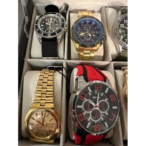 629 - A selection of wristwatches in display case to include: Bulova, Geneva, Skmei, Infantry, 18 in total... 