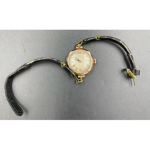 632 - A Ladies 9ct gold watch on a leather strap