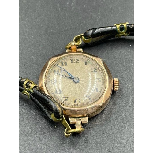 632 - A Ladies 9ct gold watch on a leather strap