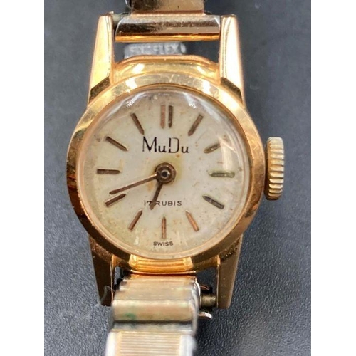 634 - A MuDu ladies vintage wristwatch in 18ct gold with expandable stainless steel band.