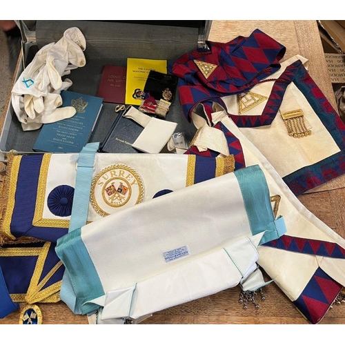 651 - A selection of masonic medals, aprons and sashes