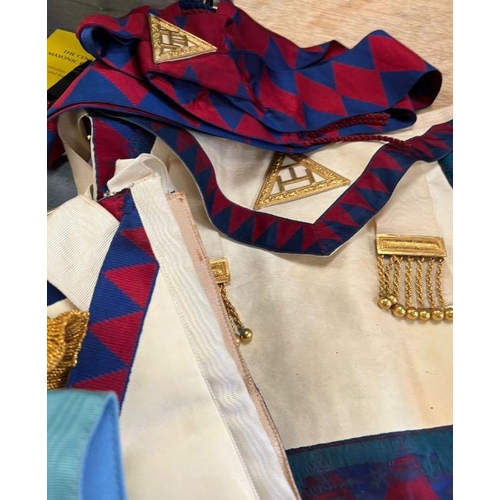 651 - A selection of masonic medals, aprons and sashes