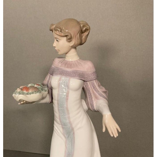 72 - A Lladro lady with a basket of fruit