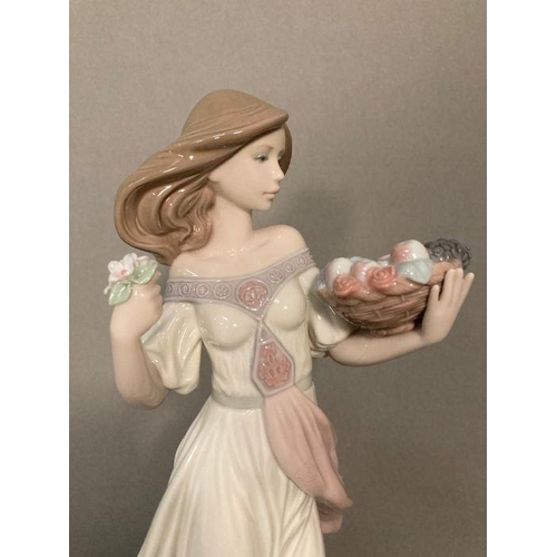 77 - A Lladro lady with a basket of fruit and a posey