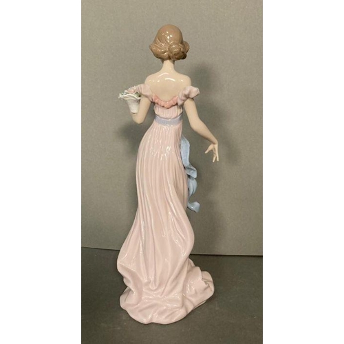 78 - A Lladro lady with a basket of flowers