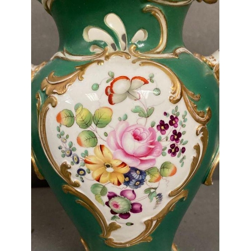 85 - A pair of 19th Century green grounds floral decorated two handled vases, hand painted H23cm