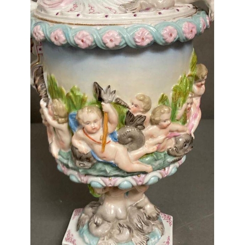 86 - A Meissen figural porcelain ewer, dolphins, cherubs and fawn to handle H38cm