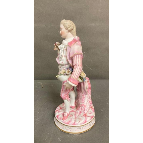 96 - An 19th Century Bisque figure of a gentleman holding a hat with flowers