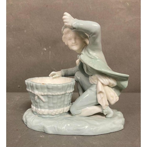 98 - A late Victorian Mintons porcelain figure of a boy with a basket, marked to base