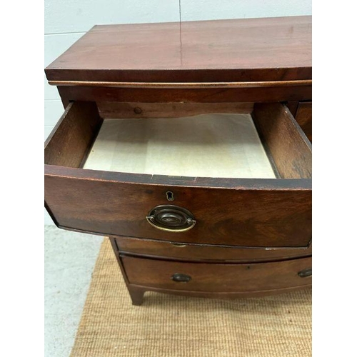 1 - A two over three mahogany bow fronted chest of drawers, brass drop handles on splayed legs.(H 114cm ... 