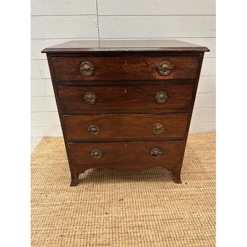11 - A mahogany four drawer chest of drawers on splade feet on brass drop handles (H 71 cm x D 44cm x W 6... 