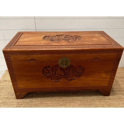 14 - A Camphor chest with Oriental carving depicting boats in a harbour scene with floral boarder ( H 59c... 
