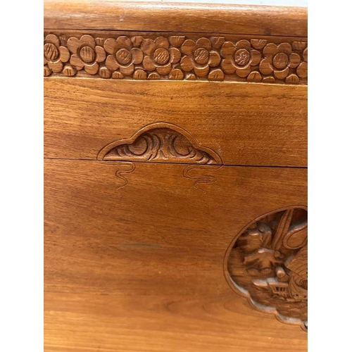 14 - A Camphor chest with Oriental carving depicting boats in a harbour scene with floral boarder ( H 59c... 