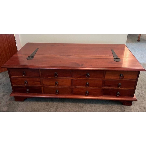 18 - A cherry wood twelve drawer coffee table opening to storage inside (H42cm W118cm D67cm)