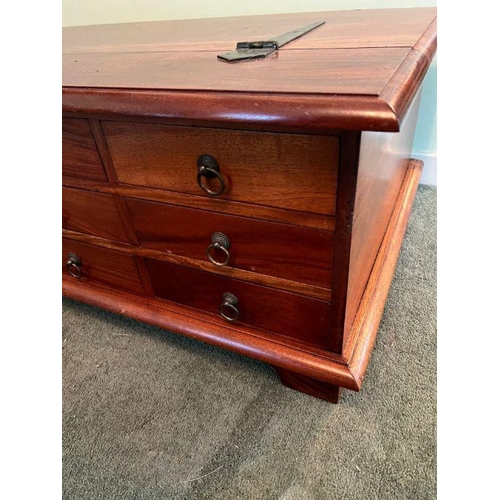 18 - A cherry wood twelve drawer coffee table opening to storage inside (H42cm W118cm D67cm)
