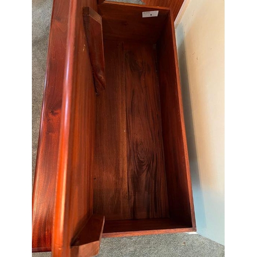 18 - A cherry wood twelve drawer coffee table opening to storage inside (H42cm W118cm D67cm)