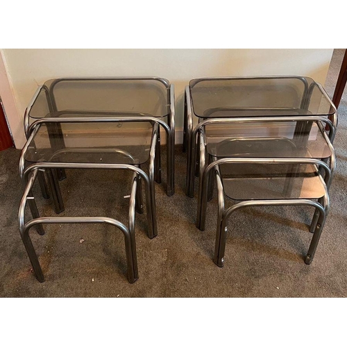 20 - Two sets of vintage nesting side tables, smoked glass and chrome tubular frame (One missing glass) (... 