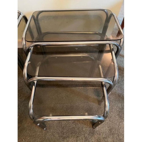 20 - Two sets of vintage nesting side tables, smoked glass and chrome tubular frame (One missing glass) (... 