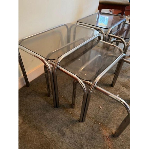 20 - Two sets of vintage nesting side tables, smoked glass and chrome tubular frame (One missing glass) (... 