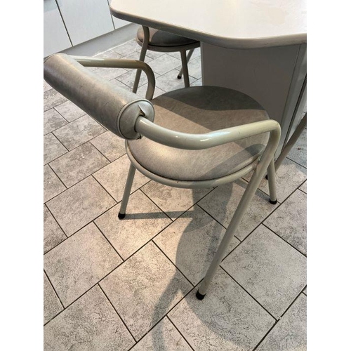 22 - A 1980's white and grey dining table and chairs, octagonal table with tubular frame chairs by Remplo... 