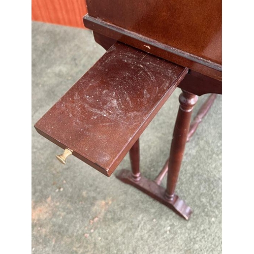 27 - A mahogany book stand on turned legs (H70cm W48cm D19cm)