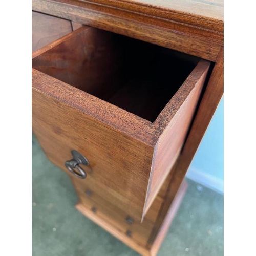 29 - A hardwood tallboy with four short drawers and three long drawers (H112cm W46cm D43cm)