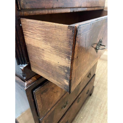 33 - A George III style chest on chest, three small drawers followed by graduated drawers below, two piec... 