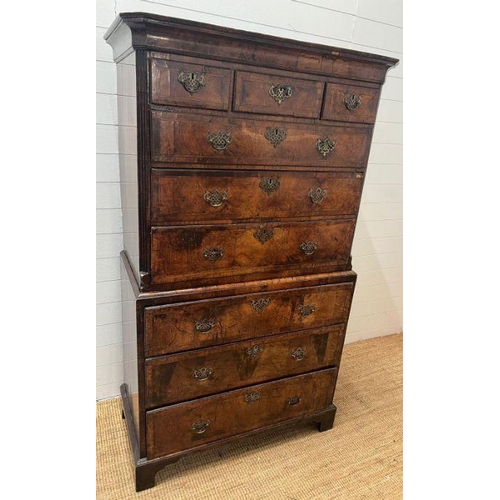 33 - A George III style chest on chest, three small drawers followed by graduated drawers below, two piec... 