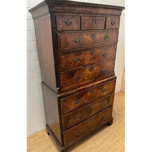 33 - A George III style chest on chest, three small drawers followed by graduated drawers below, two piec... 