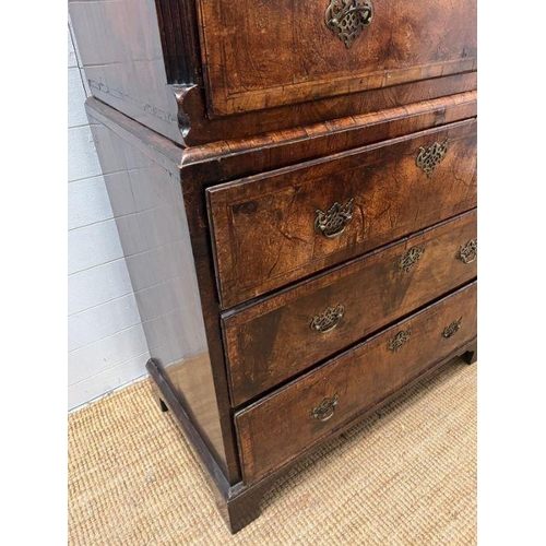 33 - A George III style chest on chest, three small drawers followed by graduated drawers below, two piec... 