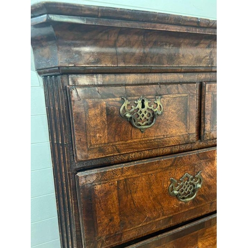 33 - A George III style chest on chest, three small drawers followed by graduated drawers below, two piec... 