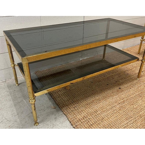 37 - A brass coffee table with smoked glass (H40cm W90cm D46cm)