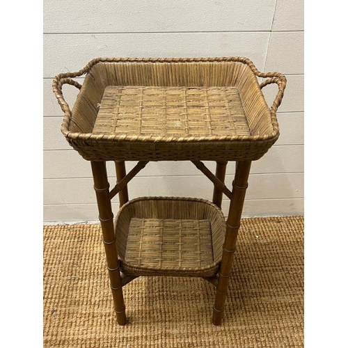 38 - A bamboo style wicker side table with basket style top (H74cm W47cm)