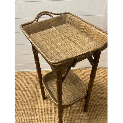 38 - A bamboo style wicker side table with basket style top (H74cm W47cm)